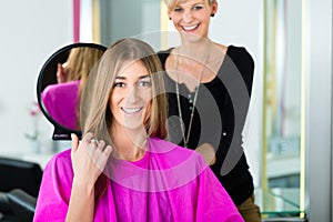 Woman at the hairdresser getting advise
