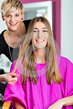 Woman at the hairdresser getting advise photo