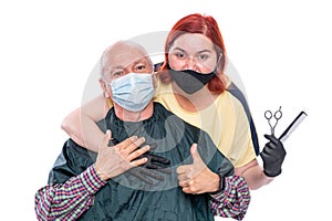 Woman hairdresser with  senior man over white background