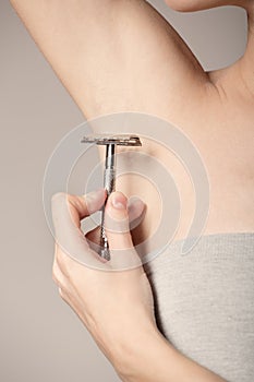Woman, hairy, unshaven, a lot of hair, smooth underarm, depilatory cream, razor photo