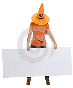 Woman with Halloween hat holding blank billboard