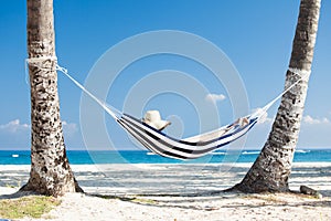 Woman in hammock at beach