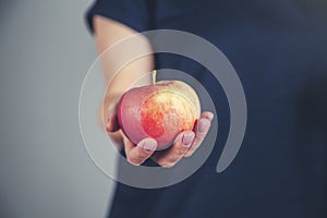 Woman hand apple