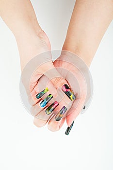 Woman hand close-up with beautiful manicure on white background