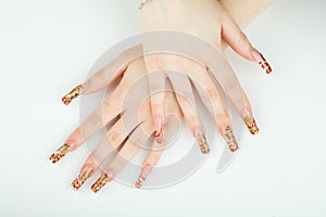 Woman hand close-up with beautiful manicure on white background