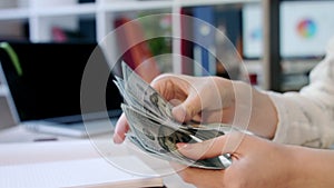 Woman hand counting dollar bills in office. Female hands counting money dollars