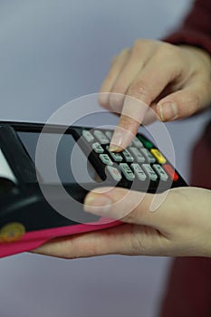 Woman hand with credit card swipe through terminal for sale