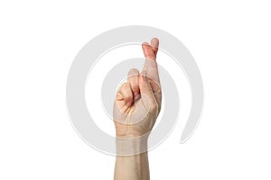 Woman hand with crossed fingers isolated