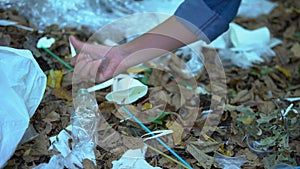 Woman hand crumpling plastic glass, waste material, pollution reduce, ecology