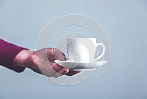 Woman hand cup of coffee