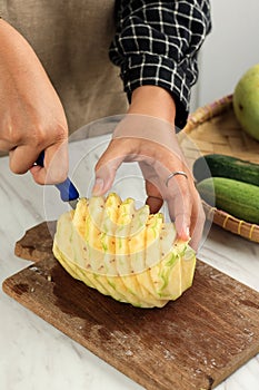 Woman Hand Cut Pineapple