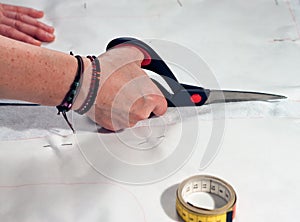 Woman hand cutting