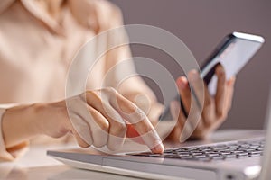 Woman hand enter a one time password for the validation process on laptop, Mobile OTP secure Verification Method, 2-Step