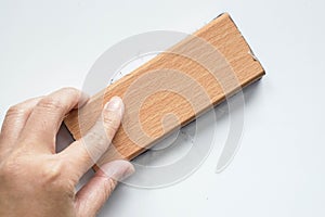 Woman hand with eraser on whiteboard