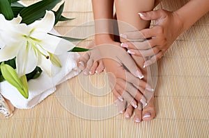 Woman hand and feet with manicure