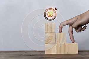 Woman hand finger walk on stacked wooden block like stairs. business development and growth concept