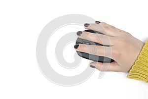 Woman hand with fresh polished red nails manicure using modern wireless optical computer mouse on white background, top