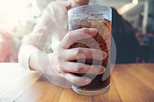 Woman hand giving glass ,Soft drinks with ice, sweethart or buddy