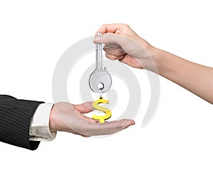 Woman hand giving key dollar sign keyring to man hand