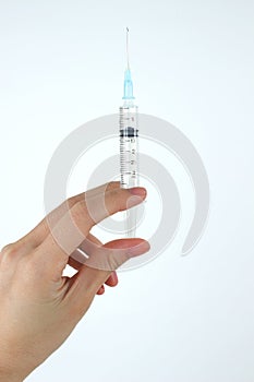 Woman hand hold syringe