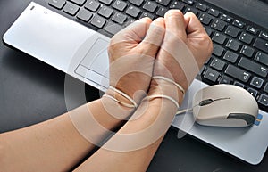 woman hand hold and were bond with computer mouse, internet addiction