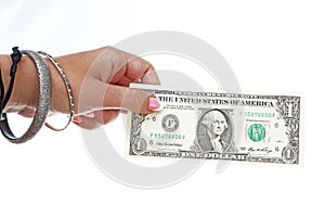 Woman hand holding american one dollar bill on isolated white cutout background. Studio photo with studio lighting easy to use for