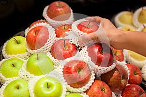 Woman hand holding an apple