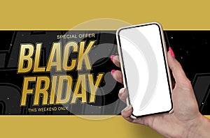 Woman Hand holding the black Mockup smartphone with beautiful nails on the background Black Friday. Mobile device isolated on blue