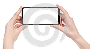 Woman hand holding the black new smartphone with blank screen isolated white background. hands using phone clipping path