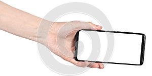 Woman hand holding the black new smartphone with blank screen isolated white background. hands using phone clipping path