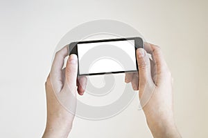 Woman hand holding black smartphone with blank screen, isolated on white background.