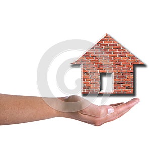 Woman hand holding brick house