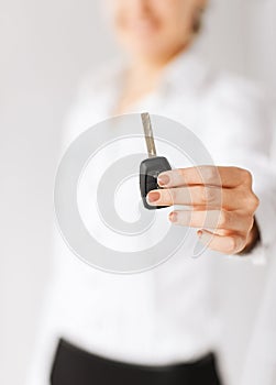 Woman hand holding car key