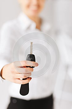 Woman hand holding car key