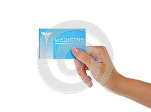 Woman hand holding card on white background. Medical service concept