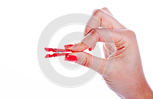 Woman hand holding clothes peg