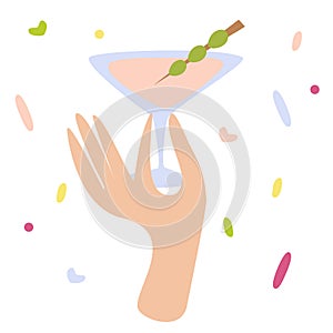 Woman hand holding a cocktail glass with martini or alcohol drink with olive. Happy hour, cheers sign, party design, celebration