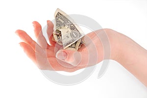 Woman hand holding crumpled dollar