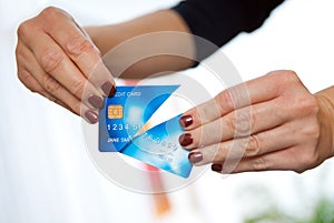 Woman hand holding cut credit card