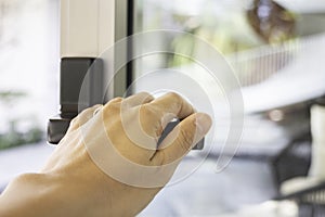 Woman hand holding the door bar to open the door