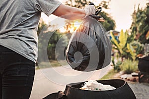 woman hand holding garbage bag for recycle cleaning