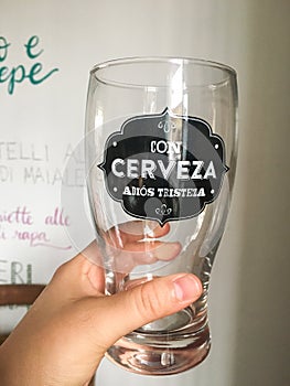 Woman hand holding a glass of beer photo