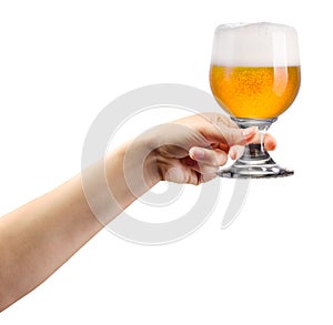 Woman hand holding glass of lager beer isolated on white