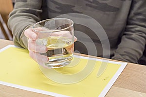 Woman hand holding glass of water