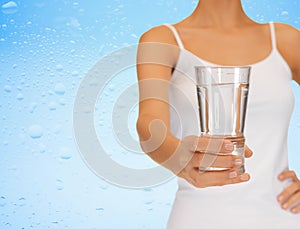 Woman hand holding glass of water