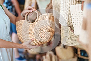 woman hand holding handcraft basket in wicker shop, Tourist visit at the old city in Chang Mai, Thailand. Asia Travel, Vacation