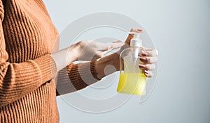 Woman hand holding liquid soap