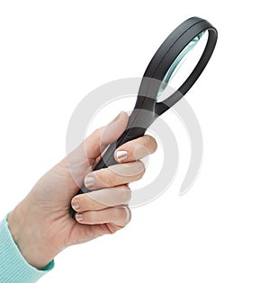 Woman hand holding magnifying glass