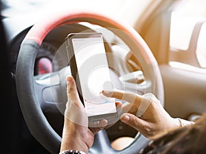 Woman hand holding mobile phone and pointing touch screen during