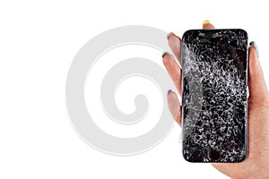 Woman hand holding modern mobile smartphone broken screen and damages. Cellphone crashed and scratch. Device destroyed. Smash